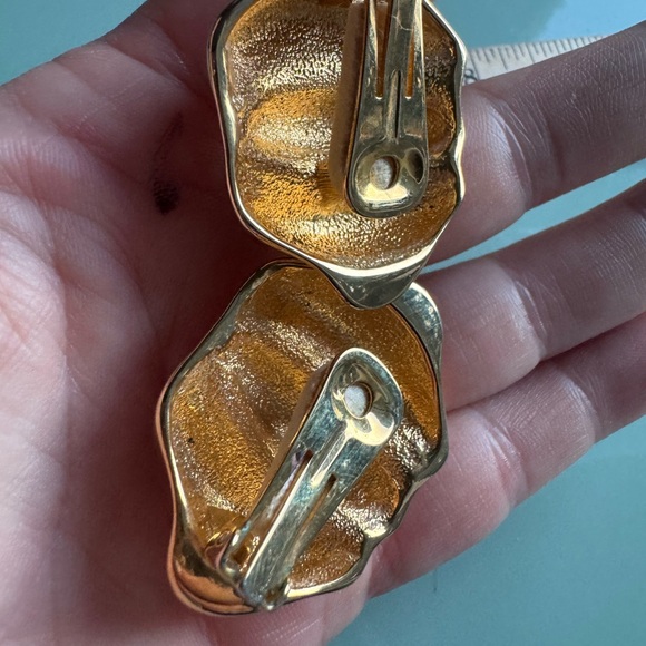 Large gold tone clip on vintage earrings